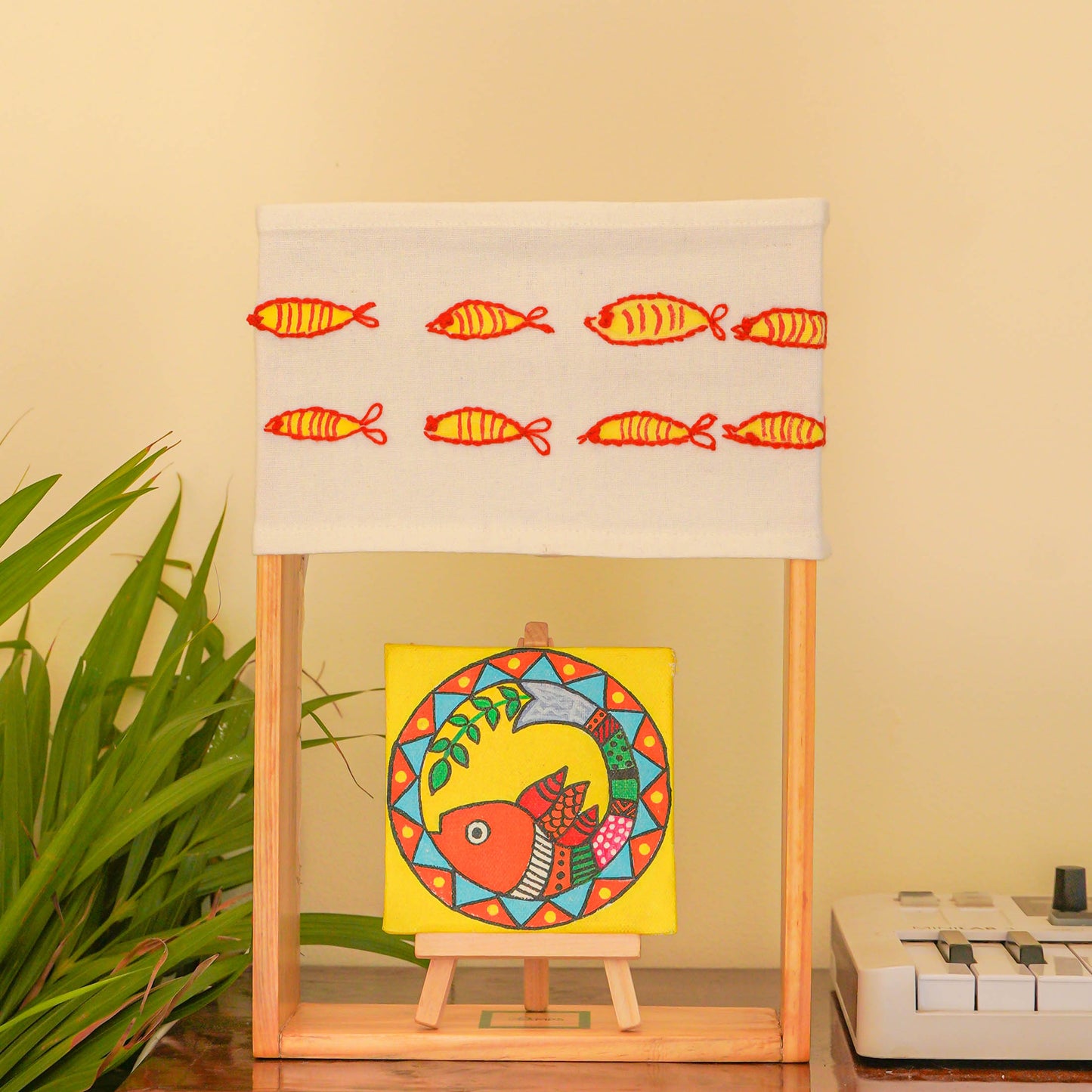 Pine Glow Madhubani Charm Lamp – Hand-Painted and hand embroidered Wooden Table Lamp with Fish Motif