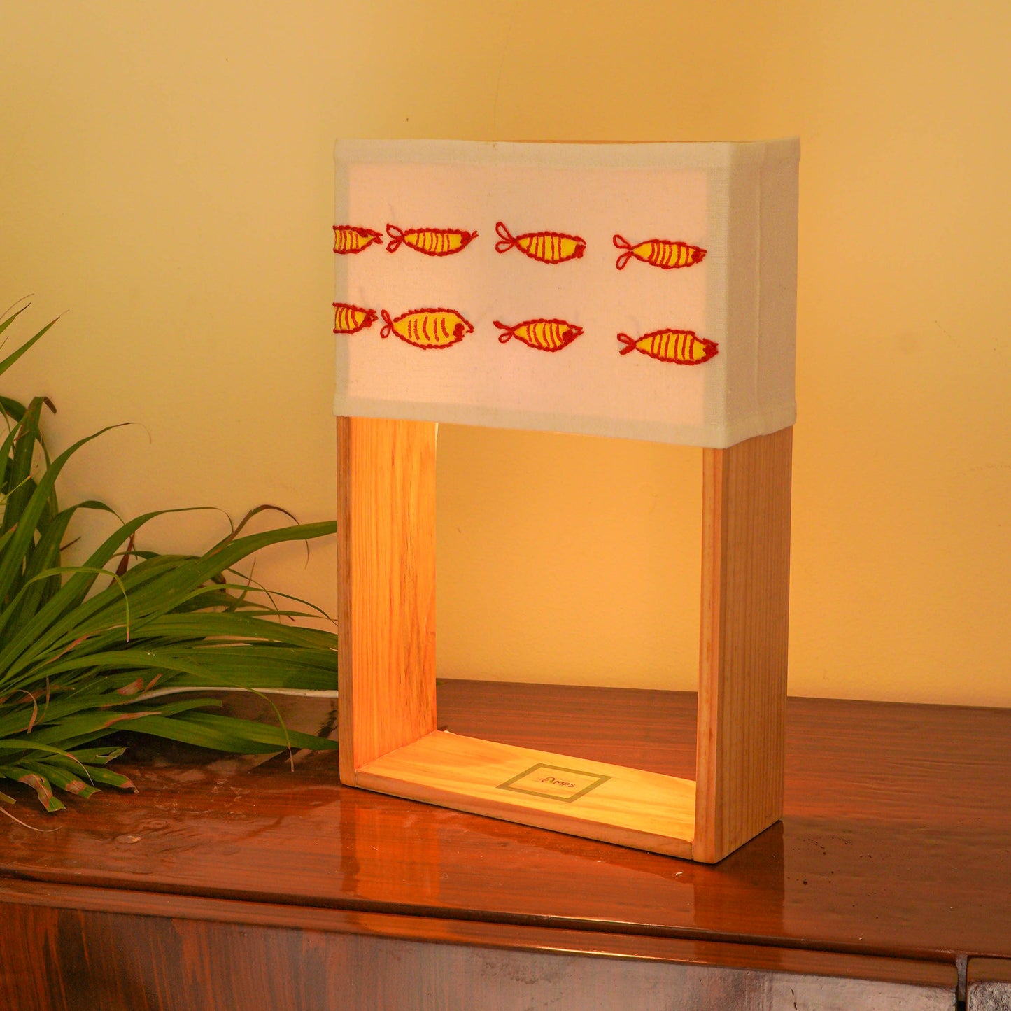 Pine Glow Madhubani Charm Lamp – Hand-Painted and hand embroidered Wooden Table Lamp with Fish Motif